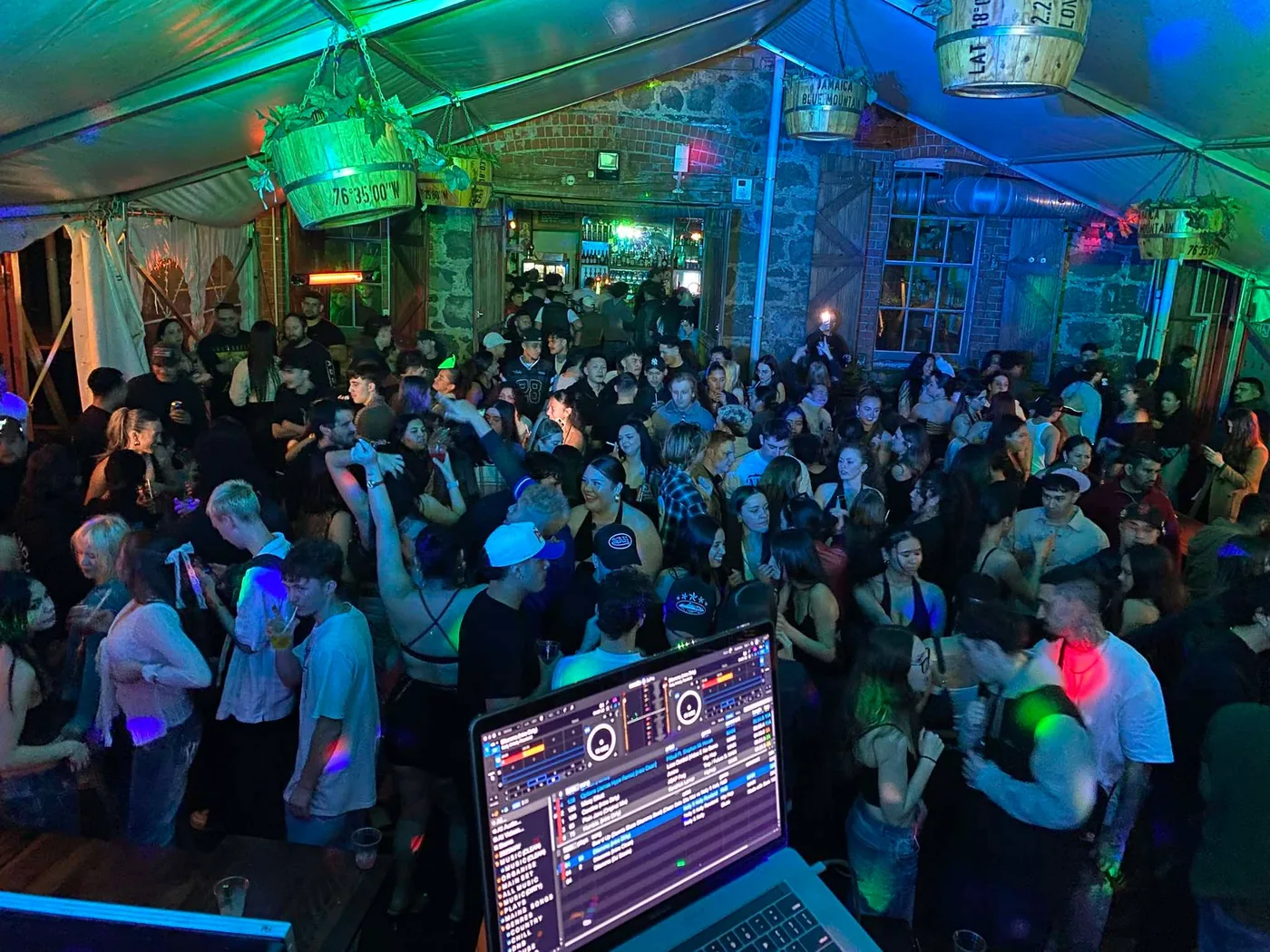 Packed dance floor from behind the decks